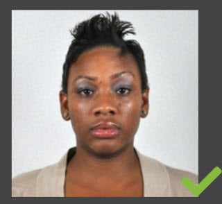 The customer is directly facing the camera with a neutral expression. Eyes are clearly visible.
