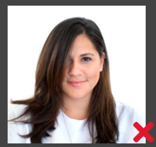 This image is unacceptable. The customer's hair blocks a portion of her face.